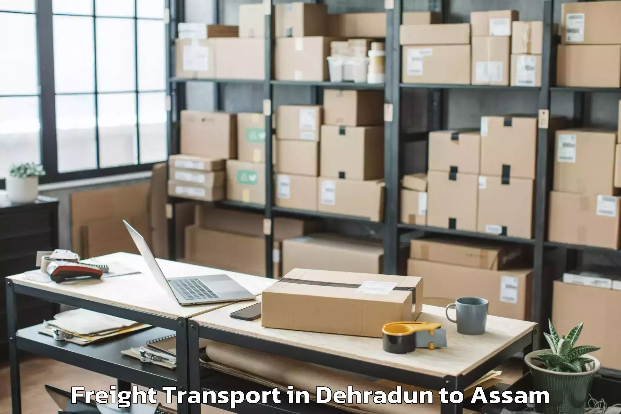 Book Dehradun to Goalpara Freight Transport